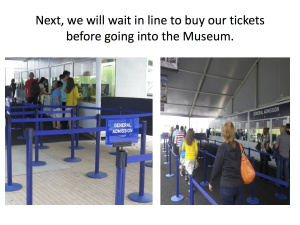 Stanchions arranged in front of the ticket kiosks with people waiting in line