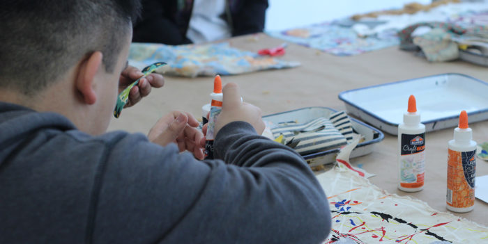 back view of a child making art